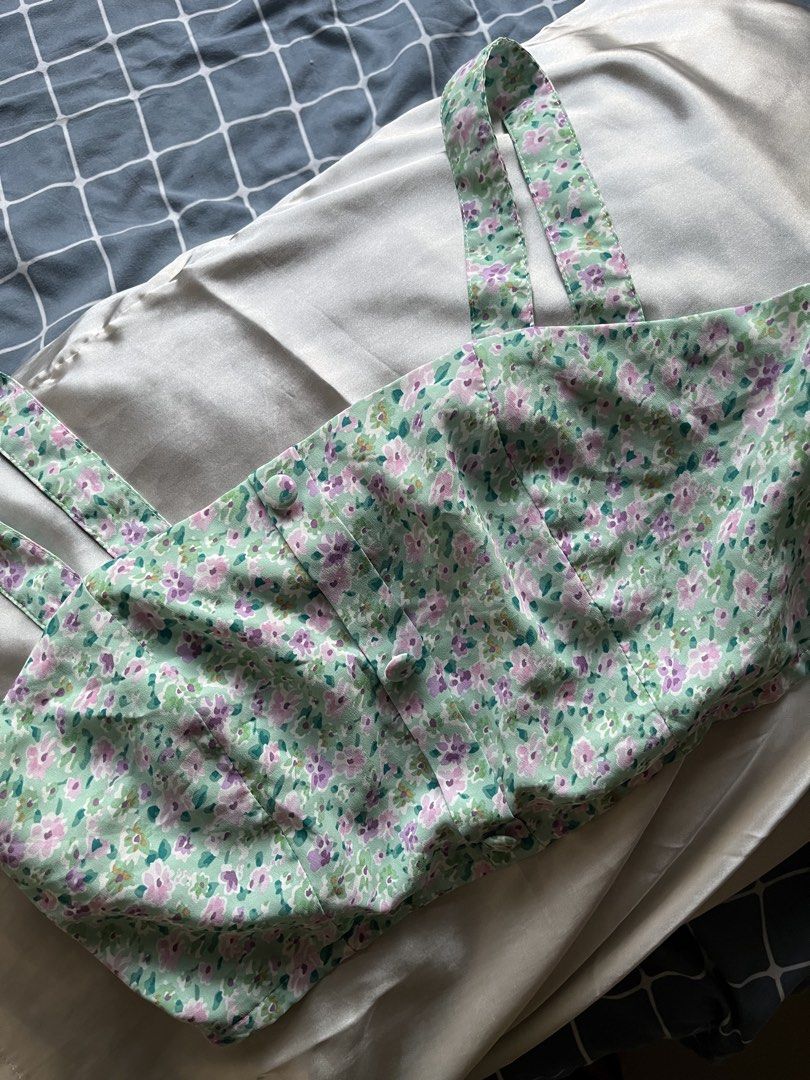 Floral Crop Top (Category: Others Tops) located in Mandaluyong City. Submitted by _cfpl (Listing ID 1432496873, Image 2). Description: - Floral print in green and purple - Wide straps - Button-down front - Lightweight fabric - Great for warm weather - Versatile style.