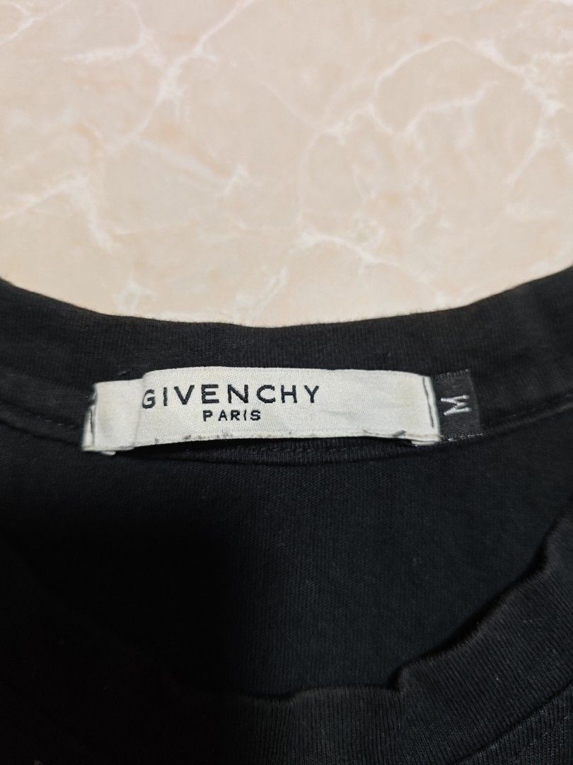 Givenchy Jesus Print T-shirt (Category: Tshirts & Polo Shirts ) located in Cabuyao City. Submitted by grand_vault (Listing ID 1432579148, Image 2). Description: - Givenchy T-shirt - Black color - Features a Jesus print - Size: M - Crew neck - Short sleeves - Authentic with Givenchy logo tag - Unique design - 22x28.