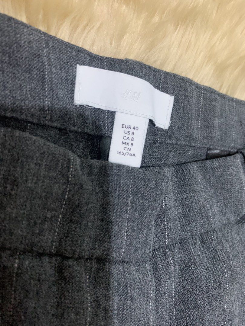 H&M Gray Pinstripe Wide Leg Pants (Category: Other Bottoms) located in Paranaque City. Submitted by vbvessentials (Listing ID 1432504639, Image 1). Description: H&M Wide Leg Pants waist: approximately 30 inches Length: approximately 38 inches Great for work or casual wear. .