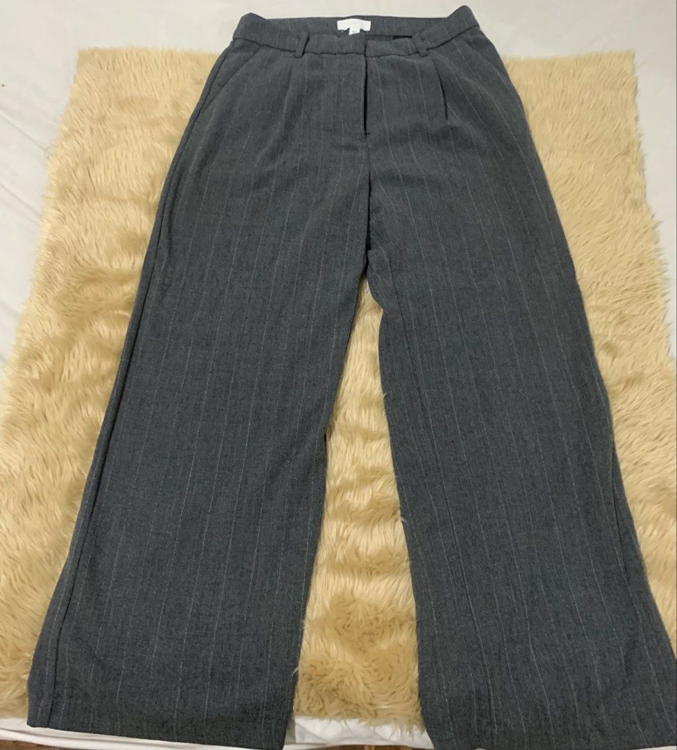 H&M Gray Pinstripe Wide Leg Pants (Category: Other Bottoms) located in Paranaque City. Submitted by vbvessentials (Listing ID 1432504639, Image 2). Description: H&M Wide Leg Pants waist: approximately 30 inches Length: approximately 38 inches Great for work or casual wear. .