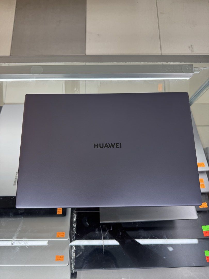 Huawei Laptop with Intel Core i5 (Category: Laptops & Notebooks) located in Manila. Submitted by oddlion-e6f6 (Listing ID 1432485939, Image 2). Description: - Huawei laptop with a sleek grey finish - Intel Core i5 processor - Arabic keyboard - Includes touchpad - Features Huawei Share sticker - Screen displays a scenic landscape - Huawei logo on the back .