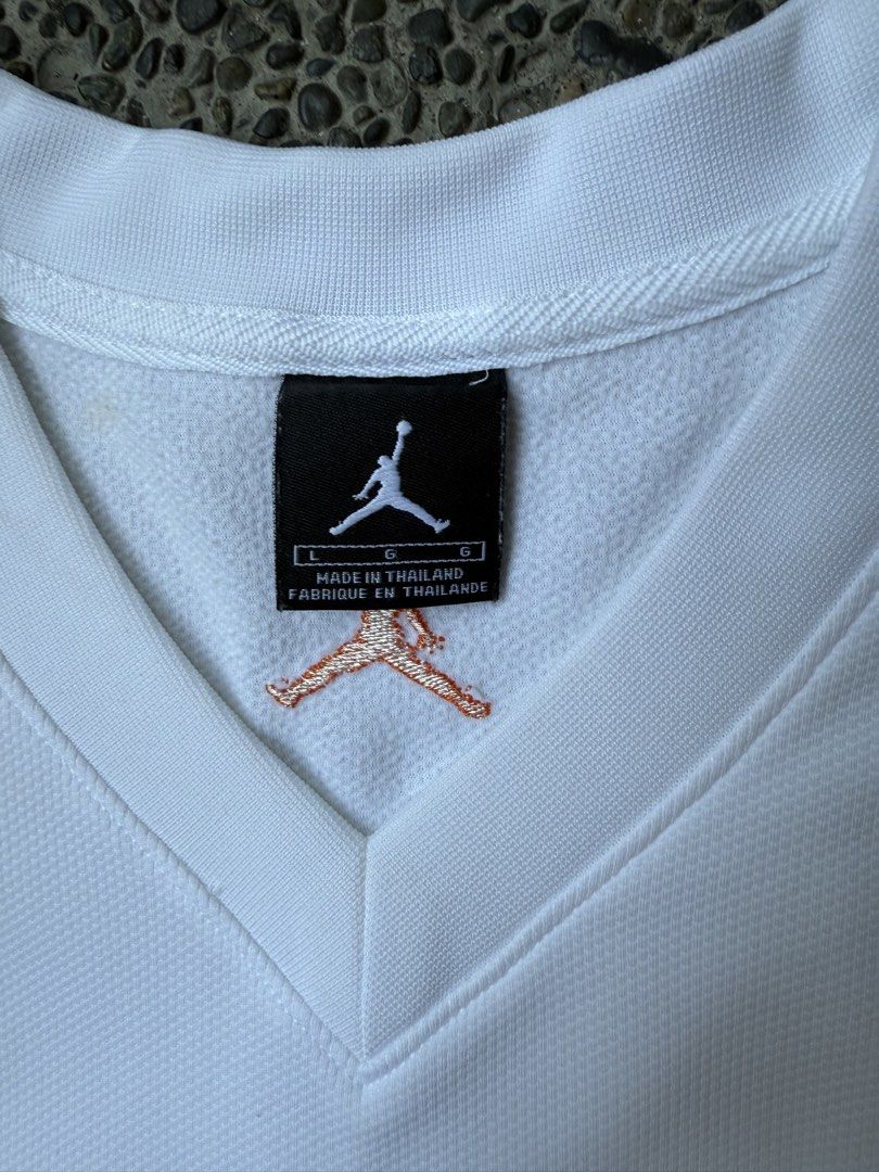 Jordan Basketball Jersey White Blue (Category: Activewear) located in Dinalupihan. Submitted by thrift.trips (Listing ID 1432562699, Image 3). Description: - Authentic Jordan basketball jersey - Color: White and Blue - Features Jumpman logo and "JORDAN" across the front - Displays "23" on the back - Size: L - Made in Thailand - Material: 100% polyester - Perfect for basketball fans and casual wear - Length 32 - Width 23.