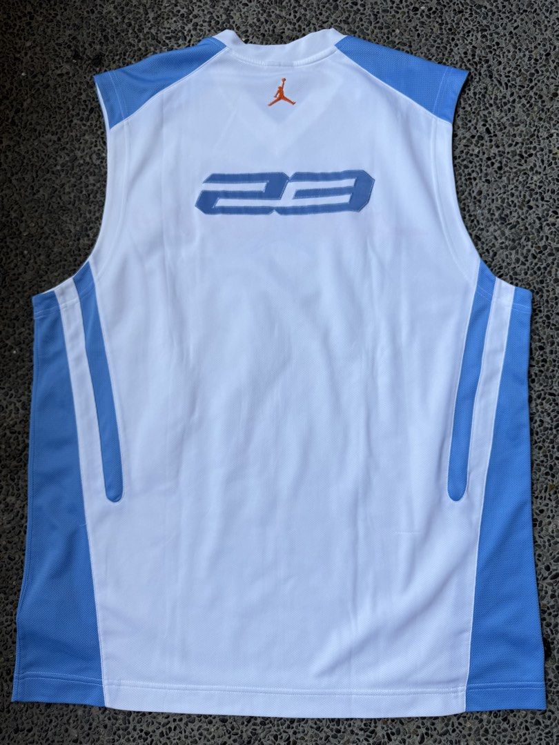 Jordan Basketball Jersey White Blue (Category: Activewear) located in Dinalupihan. Submitted by thrift.trips (Listing ID 1432562699, Image 2). Description: - Authentic Jordan basketball jersey - Color: White and Blue - Features Jumpman logo and "JORDAN" across the front - Displays "23" on the back - Size: L - Made in Thailand - Material: 100% polyester - Perfect for basketball fans and casual wear - Length 32 - Width 23.