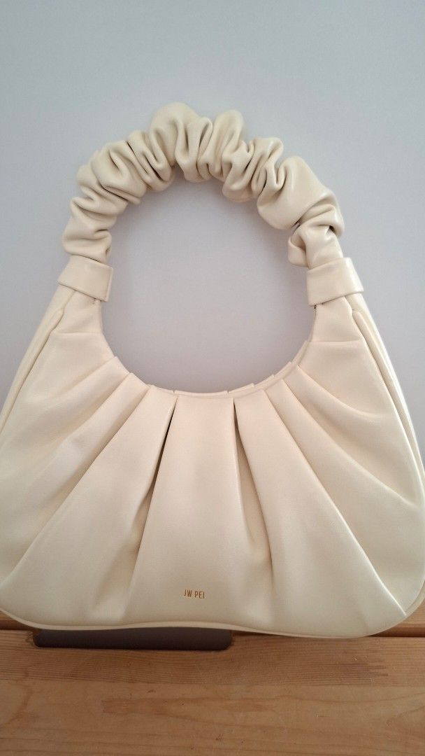 JW PEI Gabbi Bag - Cream (Category: Purses & Pouches) located in Mandaluyong City. Submitted by lgonz (Listing ID 1432512649, Image 3). Description: - Cream-colored JW PEI Gabbi bag -Vegan leather - Ruched handle and gathered design - Small gold logo - Versatile neutral color .