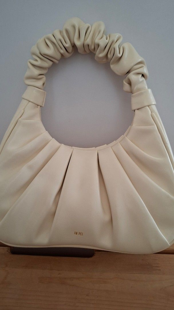 JW PEI Gabbi Bag - Cream (Category: Purses & Pouches) located in Mandaluyong City. Submitted by lgonz (Listing ID 1432512649, Image 2). Description: - Cream-colored JW PEI Gabbi bag -Vegan leather - Ruched handle and gathered design - Small gold logo - Versatile neutral color .