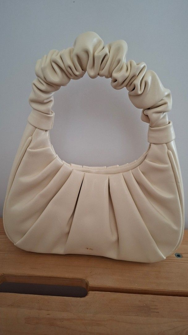 JW PEI Gabbi Bag - Cream (Category: Purses & Pouches) located in Mandaluyong City. Submitted by lgonz (Listing ID 1432512649, Image 1). Description: - Cream-colored JW PEI Gabbi bag -Vegan leather - Ruched handle and gathered design - Small gold logo - Versatile neutral color .