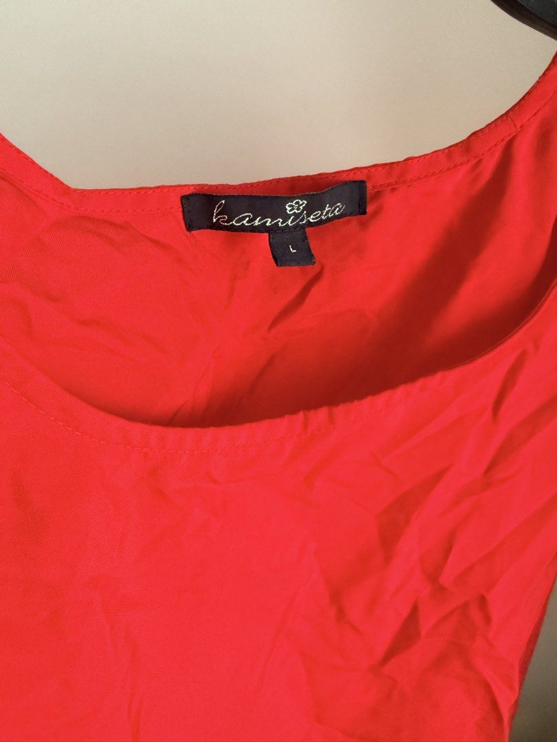 Kamiseta Red Ruffle Sleeve Top (Category: Blouses) located in Cebu City. Submitted by dr_marsh (Listing ID 1432437909, Image 3). Description: Kamiseta red top, size L. Features a round neckline, short sleeves with ruffle details, and a straight hem. Lightweight and perfect for casual wear..