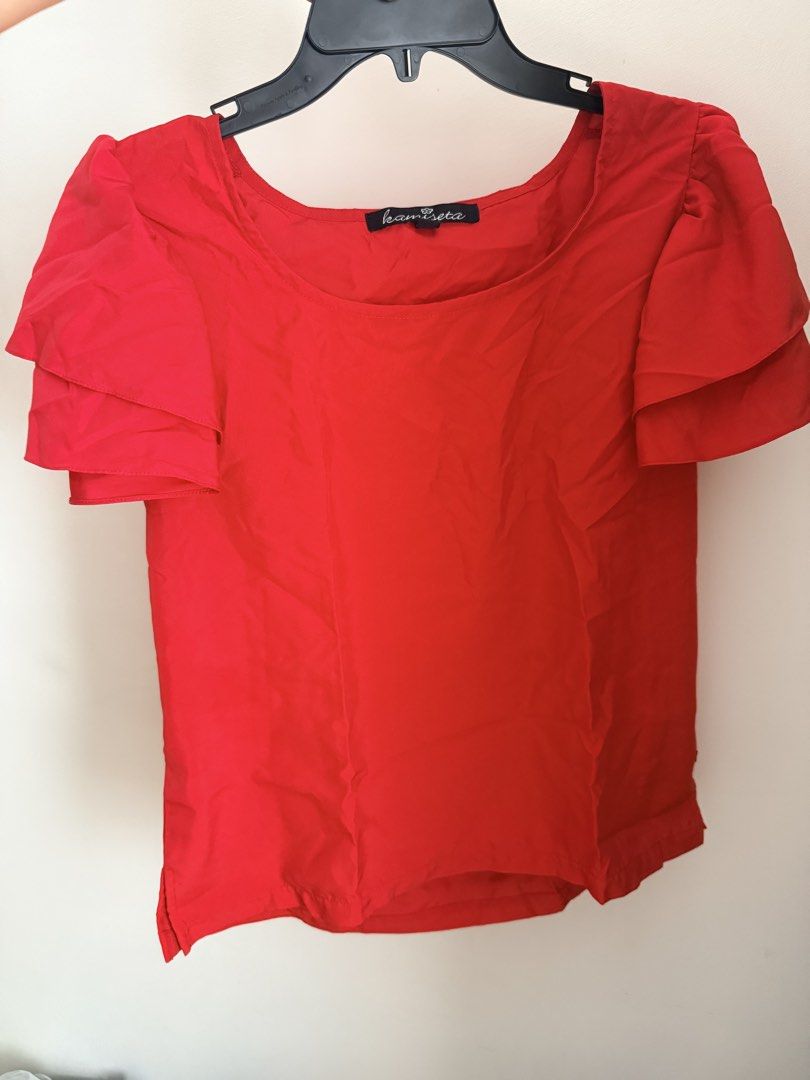 Kamiseta Red Ruffle Sleeve Top (Category: Blouses) located in Cebu City. Submitted by dr_marsh (Listing ID 1432437909, Image 1). Description: Kamiseta red top, size L. Features a round neckline, short sleeves with ruffle details, and a straight hem. Lightweight and perfect for casual wear..
