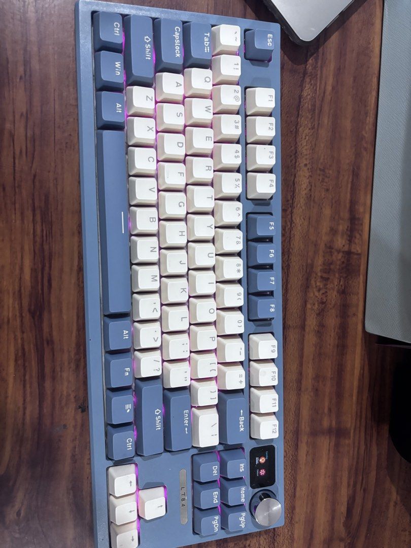 LANGTU LT84 Mechanical Keyboard (Category: Computer Keyboard) located in Cebu City. Submitted by makeupdontbreakup (Listing ID 1432450256, Image 1). Description: - Lofree LT84 mechanical keyboard - Blue and white keycap design - Includes a rotary knob - Features function keys - Power switch located at the back - Compact layout.