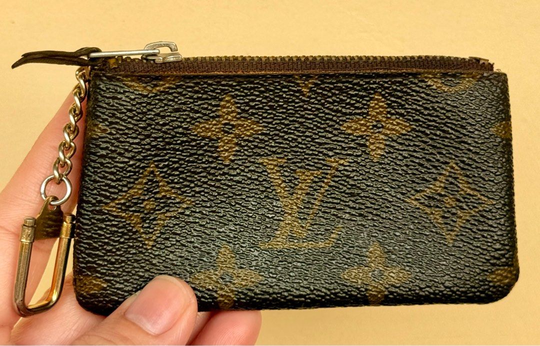 Louis Vuitton Monogram Coin Purse/ Key Pouch (Category: Luxury Bags & Wallets) located in Paranaque City. Submitted by lyn0618 (Listing ID 1432495692, Image 1). Description: FOR SALE! AUTHENTIC LOUIS VUITTON KEY POUCH/ COIN PURSE PRE LOVED. ITEM. HAS SIGN OF WEAR INSIDE ECLAIR. ZIPPER NO CODE. VINTAGE COIN PURSE - Authentic Louis Vuitton key pouch - Monogram canvas - Zip closure - Chain with clasp - Brown leather interior - 'ECLAIR' zipper markin