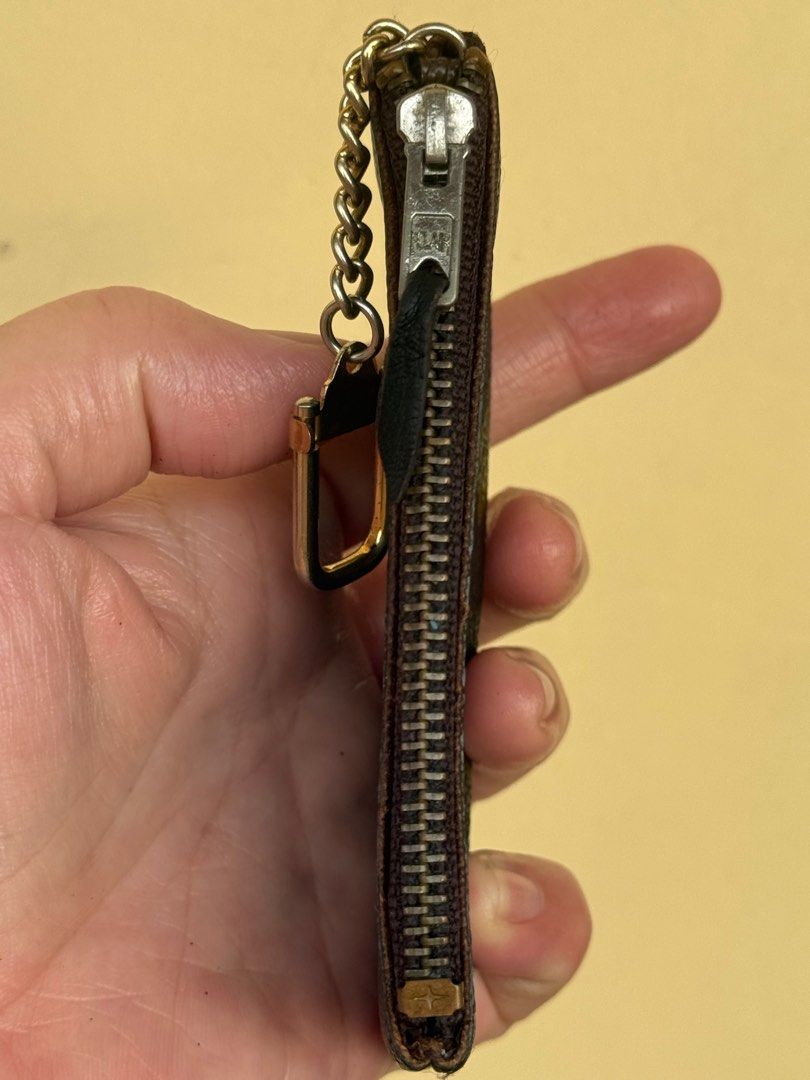 Louis Vuitton Monogram Coin Purse/ Key Pouch (Category: Luxury Bags & Wallets) located in Paranaque City. Submitted by lyn0618 (Listing ID 1432495692, Image 2). Description: FOR SALE! AUTHENTIC LOUIS VUITTON KEY POUCH/ COIN PURSE PRE LOVED. ITEM. HAS SIGN OF WEAR INSIDE ECLAIR. ZIPPER NO CODE. VINTAGE COIN PURSE - Authentic Louis Vuitton key pouch - Monogram canvas - Zip closure - Chain with clasp - Brown leather interior - 'ECLAIR' zipper markin