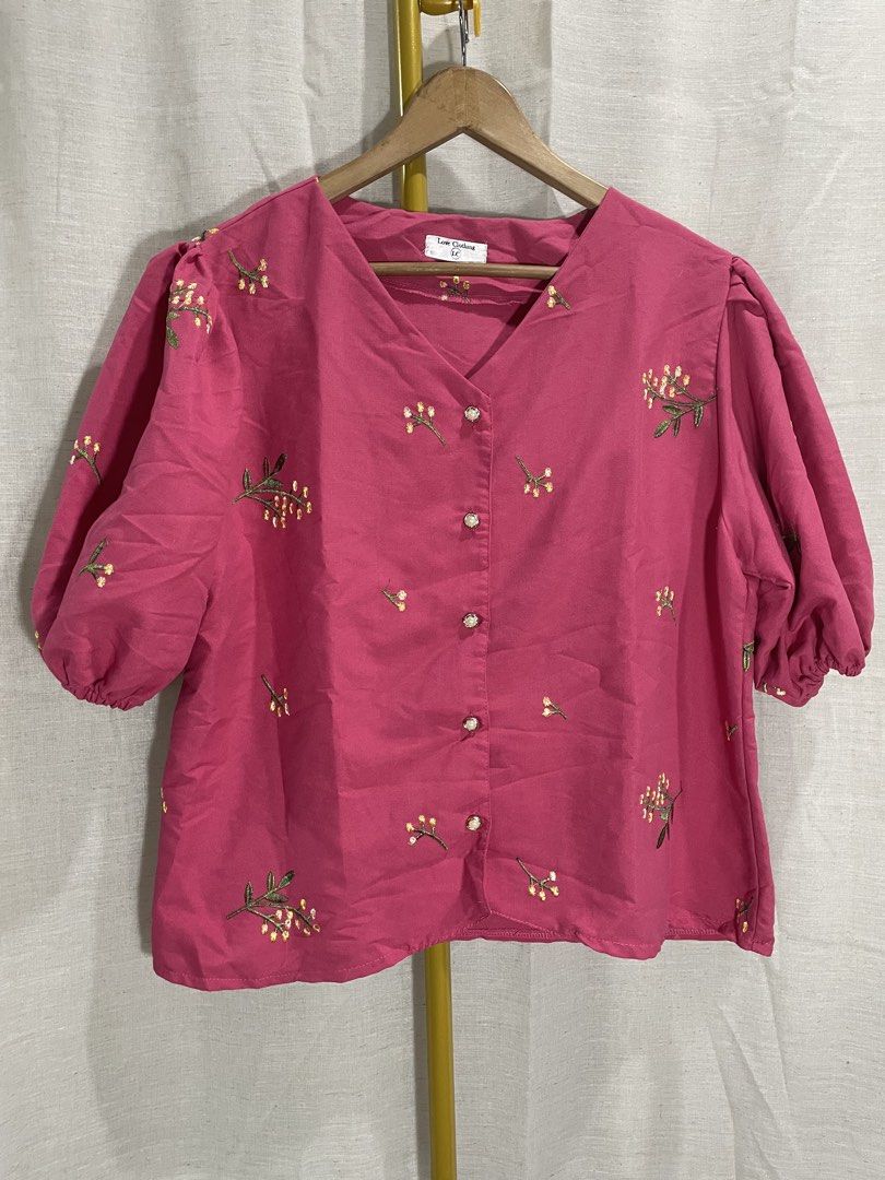 Love Clothing Embroidered Blouse (Category: Blouses) located in Quezon City. Submitted by 27ValiantStreet_Storefront (Listing ID 1432499438, Image 1). Description: - Love Clothing pink blouse - Embroidered floral details - V-neckline - Button-down closure - Short, puffed sleeves - Relaxed fit - Measurements: 42" bust, 23" length - Perfect for casual wear.