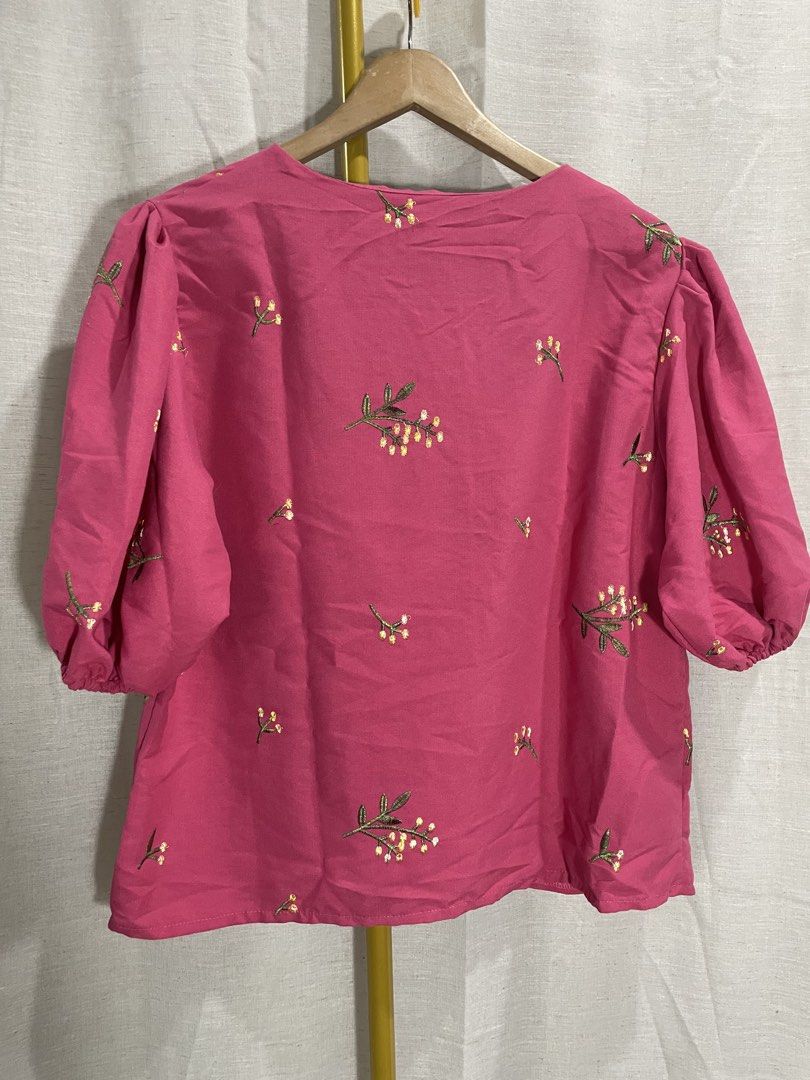 Love Clothing Embroidered Blouse (Category: Blouses) located in Quezon City. Submitted by 27ValiantStreet_Storefront (Listing ID 1432499438, Image 3). Description: - Love Clothing pink blouse - Embroidered floral details - V-neckline - Button-down closure - Short, puffed sleeves - Relaxed fit - Measurements: 42" bust, 23" length - Perfect for casual wear.