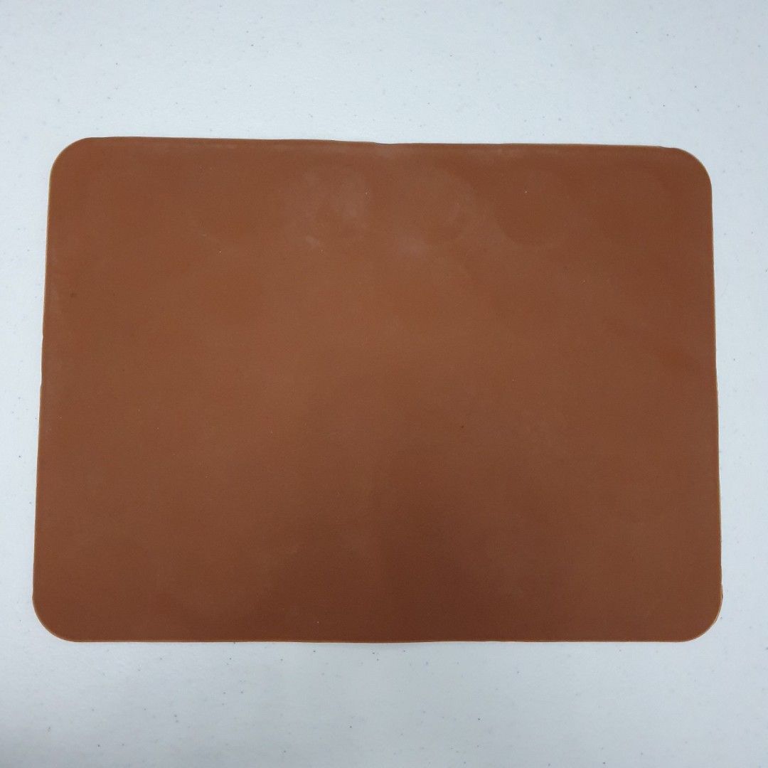 Silicone Macaron Baking Mat mold (Category: Bakeware) located in Paranaque City. Submitted by cobien (Listing ID 1432547410, Image 2). Description: - Silicone macaron baking mat - Pre-formed circles for perfect macaron placement - Measures 11.5 x 8.5 inches - Flexible and non-stick material - Easy removal of baked goods - Brown color.