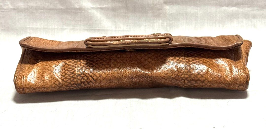 MCM Snakeskin Large Evening Clutch Bag (Category: Luxury Bags & Wallets) located in Baguio. Submitted by pwz-eshop (Listing ID 1432468019, Image 3). Description: • Please take time to read!! • I do not reserve items. I only mark items as reserved when it is paid. Paid items are shipped the next day. No shipping on holidays. • I do not have when worn pictures, please rely on actual dimensions for sizing. • Up for Grabs!! • Flaws: Rubs on leather s