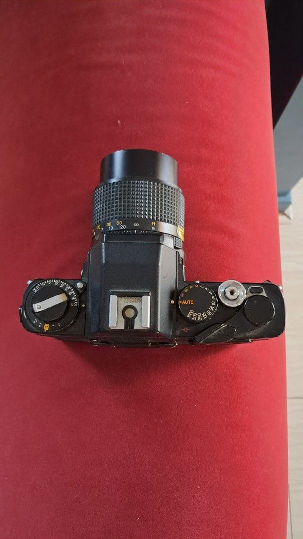 Minolta XE-7 Camera with Lens (Category: Cameras) located in Santa Rosa. Submitted by majanice (Listing ID 1432462865, Image 2). Description: - Minolta XE-7 SLR camera - Includes Minolta MD 135mm f/2.8 lens - Black camera body - Lens with focus ring and aperture settings condition untested for repair/ parts.