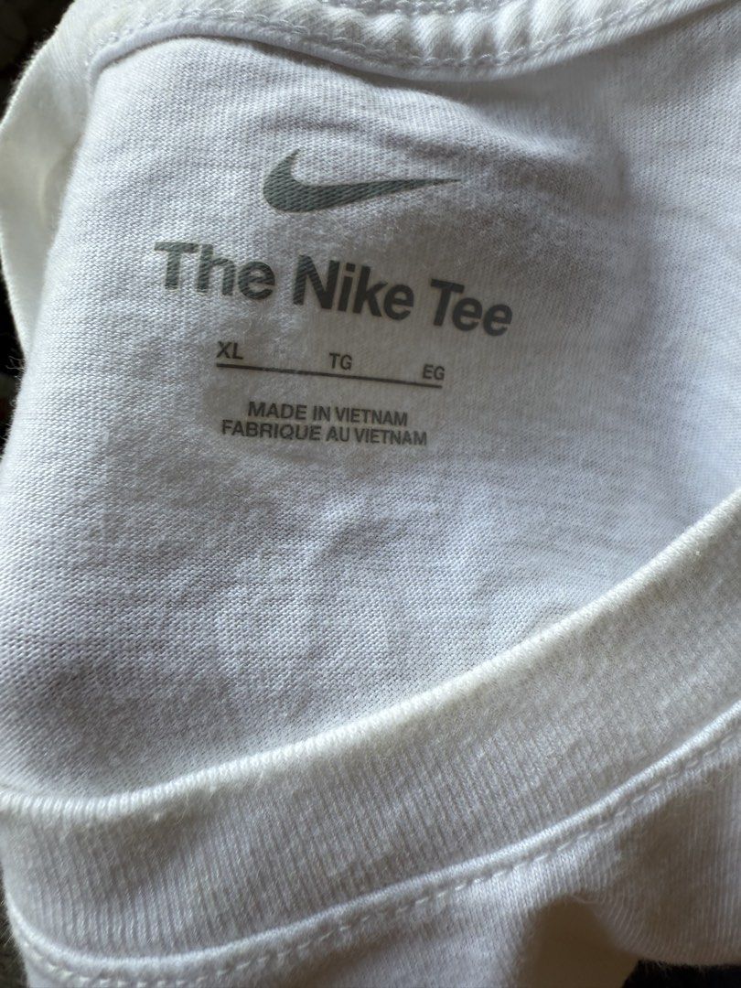 Nike The Nike Tee Tune Squad XL (Category: Tshirts & Polo Shirts ) located in Dinalupihan. Submitted by thrift.trips (Listing ID 1432565745, Image 2). Description: - Nike Tune Squad T-shirt - Size: XL - Made in Vietnam - Features Tune Squad graphic on the back - Small graphic on the front - Nike logo visible - Crew neck - Length 30 - Width 23.