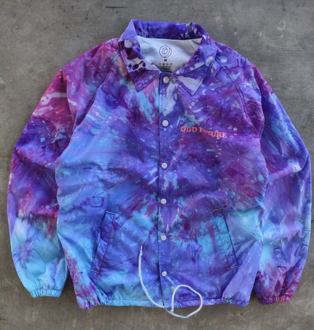 Odd Future Tie Dye Jacket (Category: Coats, Jackets and Outerwear) located in Pasig City. Submitted by khaid (Listing ID 1432527871, Image 1). Description: - Odd Future coach jacket - Tie-dye design (purple, blue, pink) - Size: xl - xxl - Features donut graphic on back - "Odd Future" logo on front - Material: Nylon - Drawstring at bottom - Button closures.