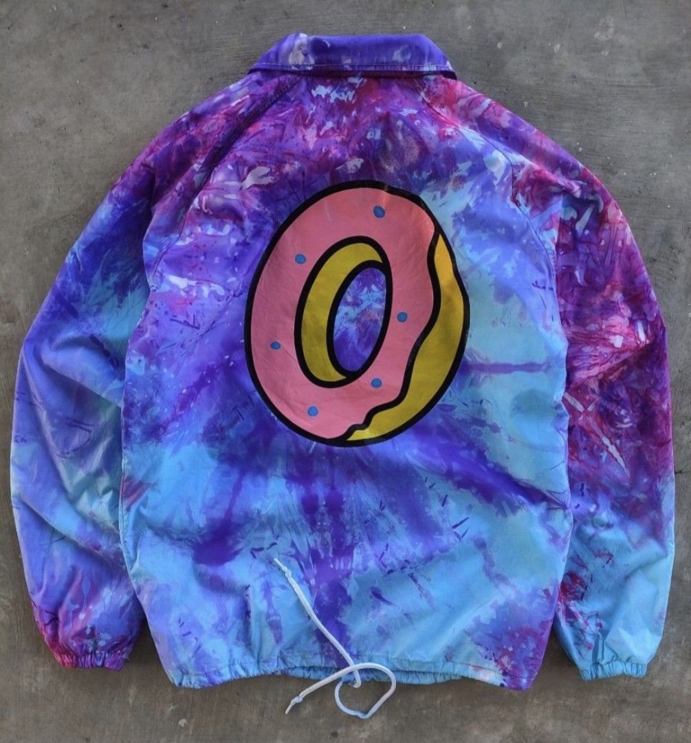 Odd Future Tie Dye Jacket (Category: Coats, Jackets and Outerwear) located in Pasig City. Submitted by khaid (Listing ID 1432527871, Image 2). Description: - Odd Future coach jacket - Tie-dye design (purple, blue, pink) - Size: xl - xxl - Features donut graphic on back - "Odd Future" logo on front - Material: Nylon - Drawstring at bottom - Button closures.