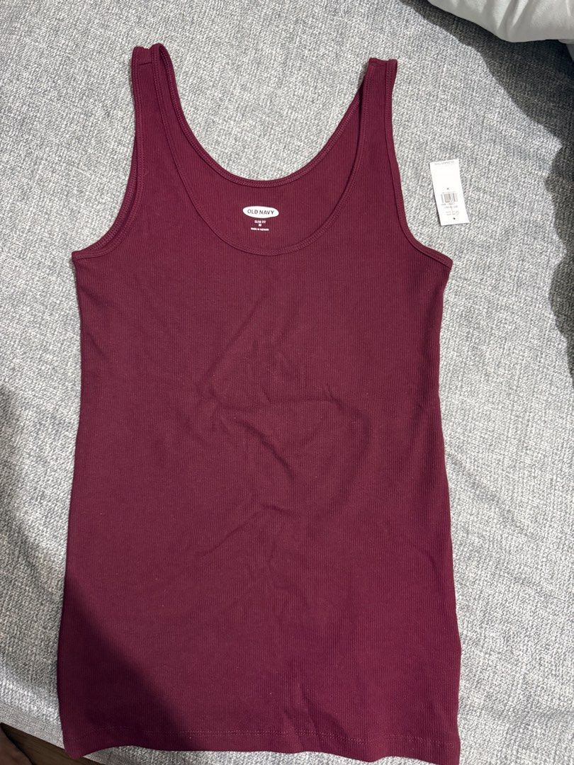 Old Navy Slim Fit Tank Top (Category: Sleeveless) located in Manila. Submitted by kmd22 (Listing ID 1432552965, Image 1). Description: - Old Navy tank top - Color: Burgundy - Size: Medium - Fit: Slim - Features: Ribbed texture, scoop neck - Made in Vietnam - Versatile for layering or standalone wear.
