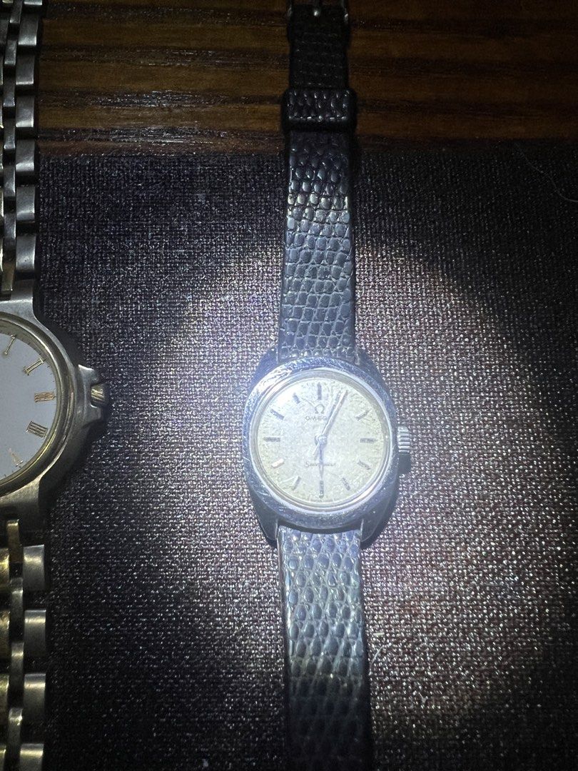 Omega Seamaster Ladies Watch (Category: Luxury Watches) located in Malabon City. Submitted by 168raymond (Listing ID 1432475506, Image 1). Description: - Vintage Omega Seamaster ladies watch. - Features a silver-tone case. - Comes with a textured black leather strap. - Light-colored dial with silver-tone hands and markers. - Omega logo visible on the dial. - A classic and elegant timepiece..