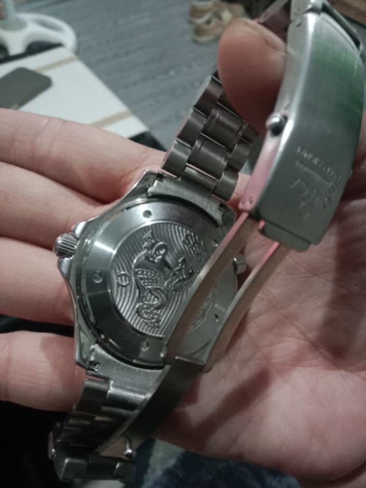 Omega Seamaster Professional 300m Watch (Category: Luxury Watches) located in Manila. Submitted by epicwind_1bf746 (Listing ID 1432578968, Image 3). Description: - Omega Seamaster Professional - Black dial - Stainless steel bracelet - Date display at 3 o'clock - Unidirectional rotating bezel - Omega Seamaster logo on case back - Omega logo on clasp.