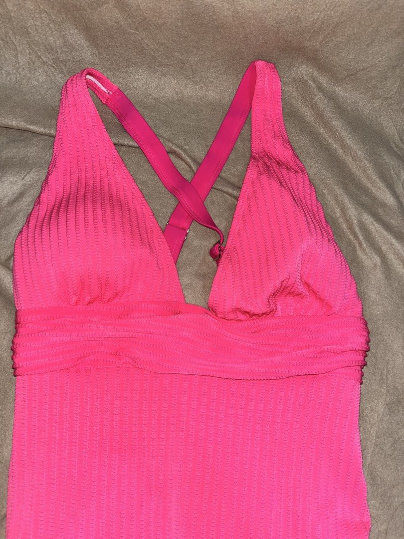 Pink Textured One-Piece Swimsuit (Category: Bikinis & Swimsuits) located in Manila. Submitted by quarishop21 (Listing ID 1432510185, Image 2). Description: (Used Once only) - Pink one-piece swimsuit - Textured fabric - Flattering plunging neckline - Stylish criss-cross back straps - Ruched detail at the waist - Solid color.