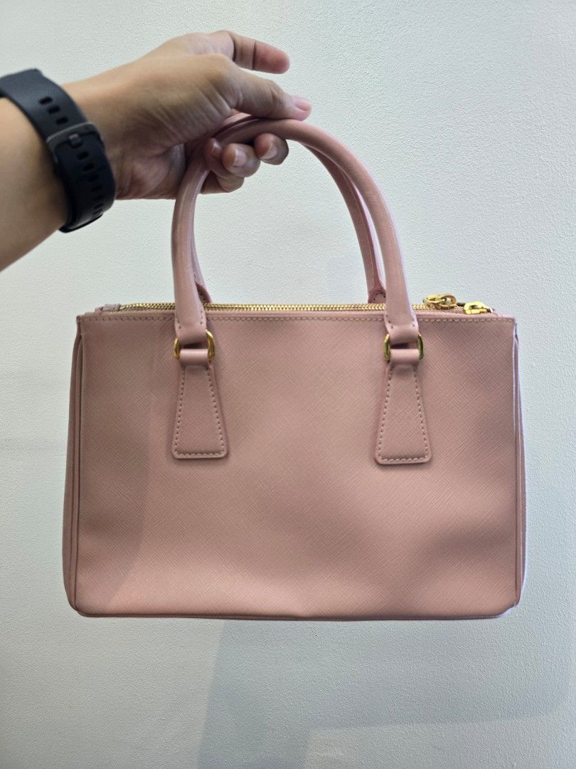 Prada Orchidea Mini Saffiano Lux Leather Double Zip Bag (Category: Luxury Bags & Wallets) located in Taguig. Submitted by mluxeph (Listing ID 1432470957, Image 3). Description: Prada Orchidea Mini Saffiano Lux Leather Double Zip Bag Gender: Ladies’ Material: Saffiano leather Stamp: 110 / BN2316 Interior: One zip pocket, one open pocket, two zip compartments and one main compartment Measurements: 10.5"L X 4"W X 7"H Handle Drop: 4" Hardware: Gold t