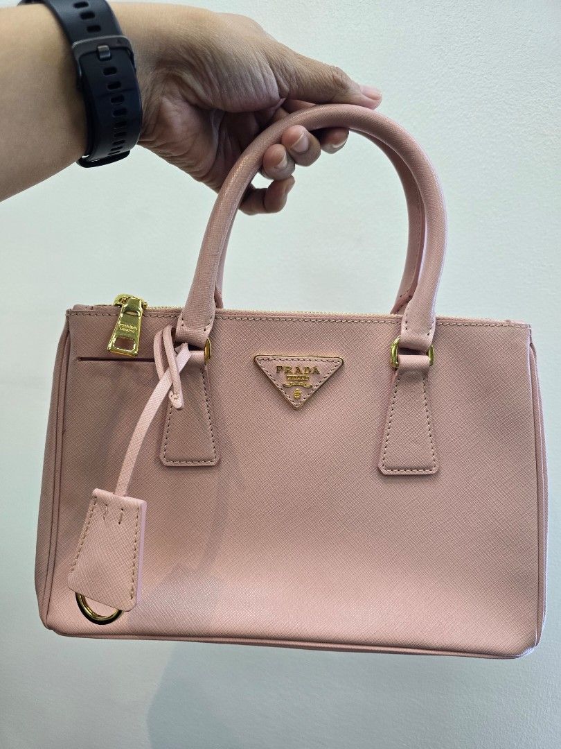 Prada Orchidea Mini Saffiano Lux Leather Double Zip Bag (Category: Luxury Bags & Wallets) located in Taguig. Submitted by mluxeph (Listing ID 1432470957, Image 2). Description: Prada Orchidea Mini Saffiano Lux Leather Double Zip Bag Gender: Ladies’ Material: Saffiano leather Stamp: 110 / BN2316 Interior: One zip pocket, one open pocket, two zip compartments and one main compartment Measurements: 10.5"L X 4"W X 7"H Handle Drop: 4" Hardware: Gold t