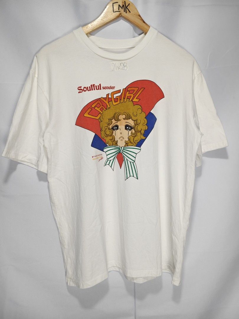 Push Button (Category: Tshirts & Polo Shirts ) located in Rizal. Submitted by itsmecle0 (Listing ID 1432393809, Image 2). Description: The featured item is a White "Soulful Seouler" Cry Girl Graphic T-Shirt from the Korean designer brand pushBUTTON. This piece is known for its edgy mix of art and retro-inspired design, featuring a crying girl illustration in a classic 1970s shoujo manga style. .