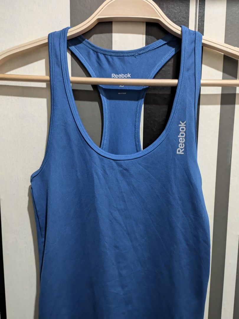 Reebok Playdry Blue Tank Top (Category: Activewear) located in Quezon City. Submitted by retrocycles (Listing ID 1432424757, Image 3). Description: Reebok Playdry tank top - Solid blue color - size XS - Lightweight polyester material - Ideal for workouts, running or casual wear.