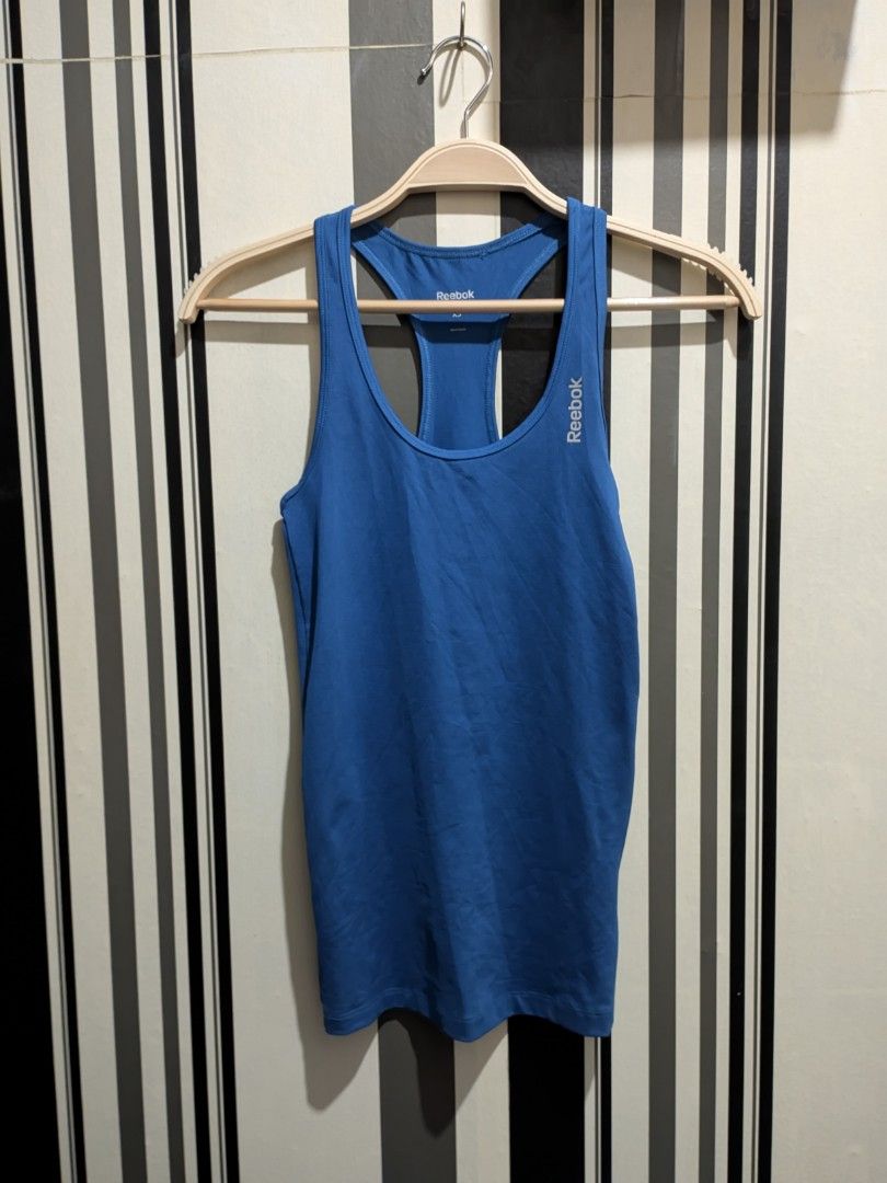 Reebok Playdry Blue Tank Top (Category: Activewear) located in Quezon City. Submitted by retrocycles (Listing ID 1432424757, Image 1). Description: Reebok Playdry tank top - Solid blue color - size XS - Lightweight polyester material - Ideal for workouts, running or casual wear.