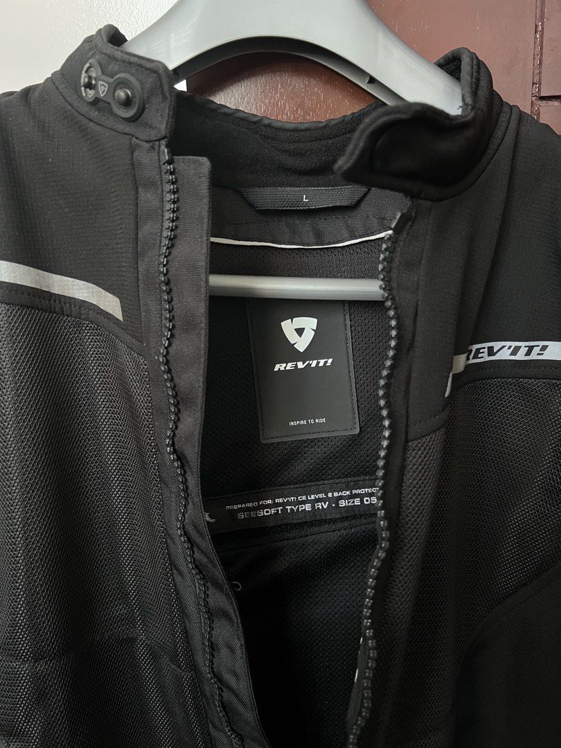 REV'IT! Motorcycle Jacket - Black - Size L (Category: Coats, Jackets and Outerwear) located in Angono. Submitted by itemswelove (Listing ID 1432418218, Image 2). Description: For Sale: - REV'IT! Black Motorcycle Jacket Airwave 3 - ORIGINAL bought from MotoMarket - For Men - Size: L - Reflective stripes on front, back, and sleeves - Zipper closure - Button collar - Mesh panel on front and back - REV'IT! logo on chest, back, and sleeves Protector p