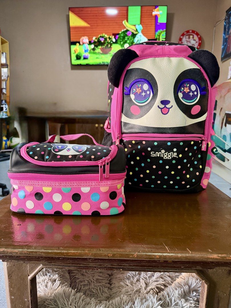 Smiggle Panda Backpack and Lunchbox Set (Category: Babies & Kids Fashion) located in Binangonan. Submitted by joizeeful (Listing ID 1432436610, Image 1). Description: - Smiggle panda backpack and lunchbox set - Adorable panda face design - Backpack features a polka dot pattern - Backpack has a front pocket and name tag - Insulated lunchbox - Ideal for school or outings.