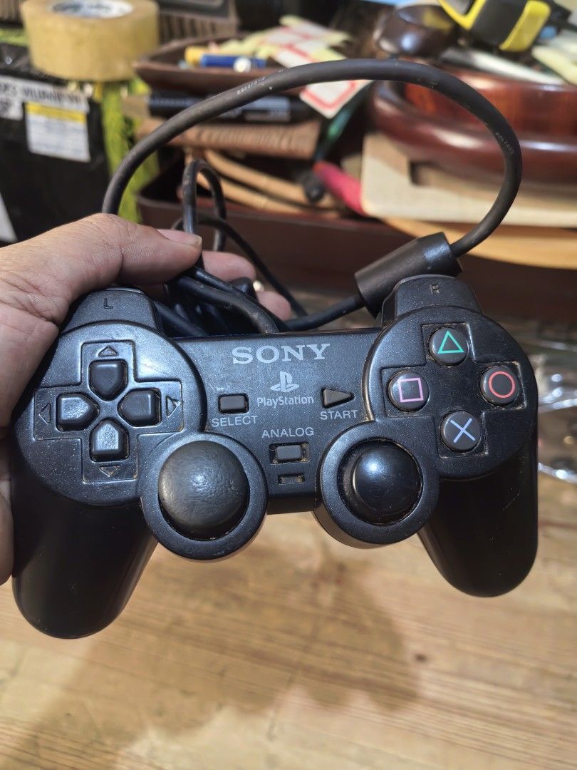 Sony PlayStation 2 DualShock 2 analog controller (Category: Controllers) located in Cebu City. Submitted by dudes_villanueva (Listing ID 1432398335, Image 1). Description: Sony PlayStation 2 DualShock 2 analog controller Model SCPH-10010. 📌 Untested. Sold as Is. Has Taped Part on wire..