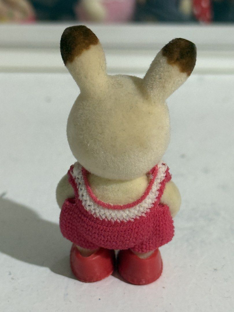 Sylvanian Families Chocolate Rabbit Toddler w/ red crochet dress | school sports day (Category: Babies & Kids Fashion) located in Antipolo. Submitted by kiksy.closet (Listing ID 1432441576, Image 2). Description: Sylvanian Families Chocolate Rabbit Toddler w/ red crochet dress | school sports day - with dirt lints + scuffings around the ears - w/ crochet dress and generic shoes.
