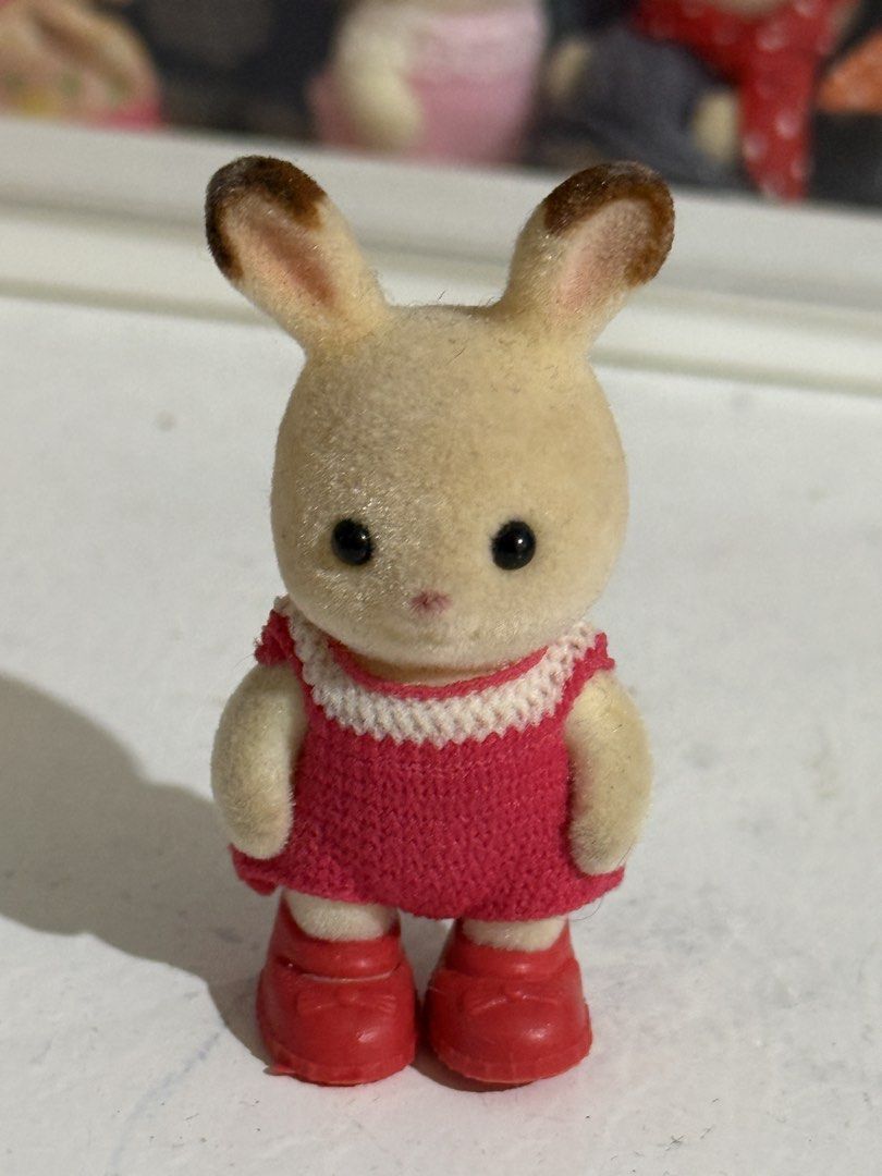 Sylvanian Families Chocolate Rabbit Toddler w/ red crochet dress | school sports day (Category: Babies & Kids Fashion) located in Antipolo. Submitted by kiksy.closet (Listing ID 1432441576, Image 1). Description: Sylvanian Families Chocolate Rabbit Toddler w/ red crochet dress | school sports day - with dirt lints + scuffings around the ears - w/ crochet dress and generic shoes.