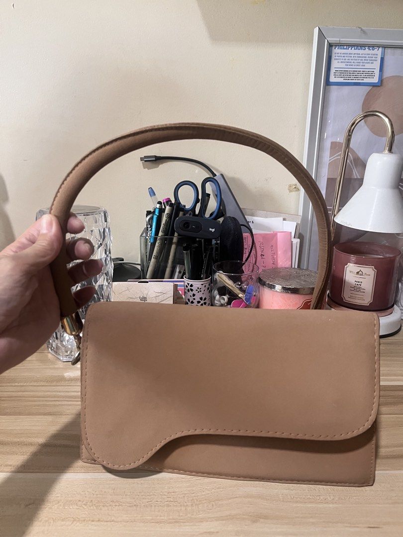 Tan Shoulder Bag with Curved Flap (Category: Shoulder Bags) located in Rizal. Submitted by authenticity17 (Listing ID 1432513364, Image 1). Description: Suede handbag once used very neet and fashionable can be worn in any outfit.