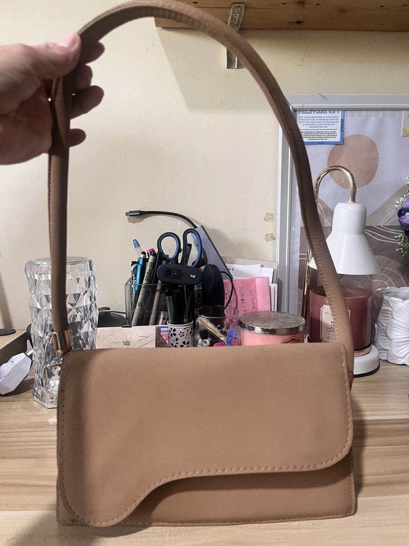 Tan Shoulder Bag with Curved Flap (Category: Shoulder Bags) located in Rizal. Submitted by authenticity17 (Listing ID 1432513364, Image 2). Description: Suede handbag once used very neet and fashionable can be worn in any outfit.