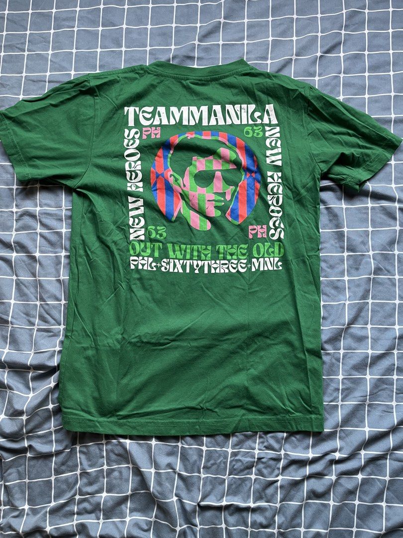 Team Manila Green Graphic Tee (Category: Tshirts & Polo Shirts ) located in Mandaluyong City. Submitted by _cfpl (Listing ID 1432495117, Image 2). Description: - Green Team Manila t-shirt - Graphic print on front with text and portrait - Larger graphic print on back with text - Short sleeves - Crew neck - Team Manila logo on front and bottom.