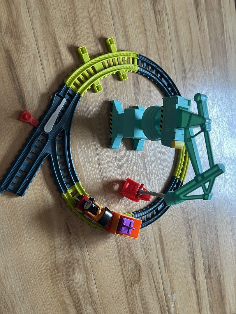 Thomas & Friends Crane Train Set (Category: Vehicle & Diecast Models) located in Quezon. Submitted by smallville.ph (Listing ID 1432441267, Image 3). Description: - ACTUAL ITEM POSTED. As is, where is Thomas & Friends train set - Includes Nia the train - Features a cargo car with purple cargo - Includes a crane for lifting and moving cargo - Comes with a track layout - Train is orange and black with the number 18.