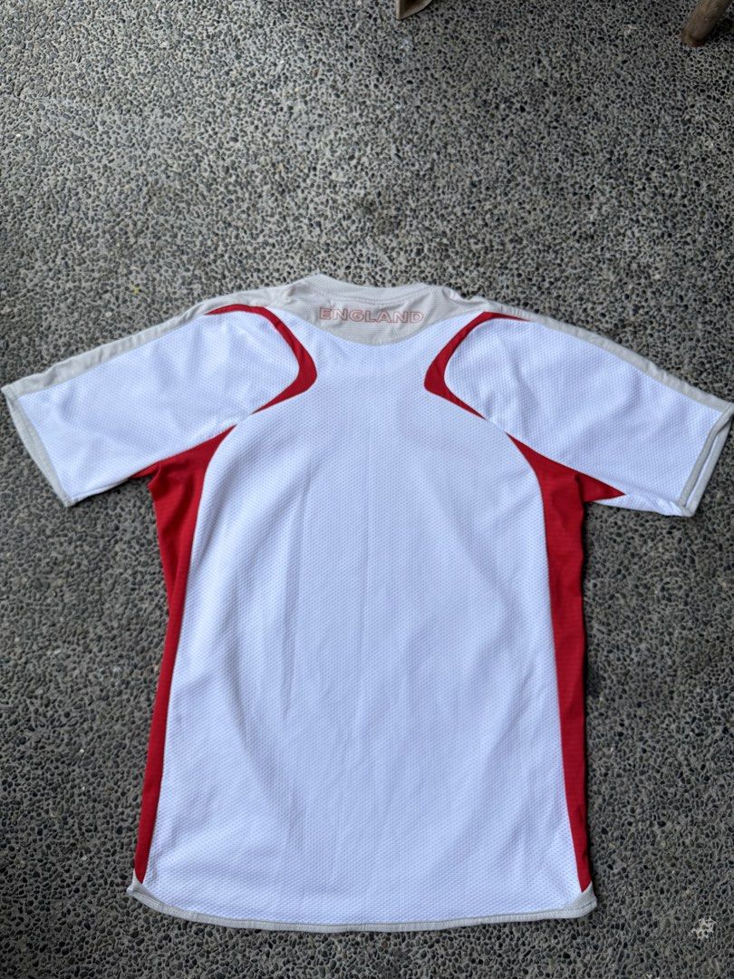 Umbro England National Team Jersey (Category: Tshirts & Polo Shirts ) located in Dinalupihan. Submitted by thrift.trips (Listing ID 1432564029, Image 2). Description: - Official England Umbro jersey - Size: M - Color: White with red accents - Material: Polyester and nylon - Features: England crest, Umbro logo, X-Static tag - Length 29 - Width 20.5.