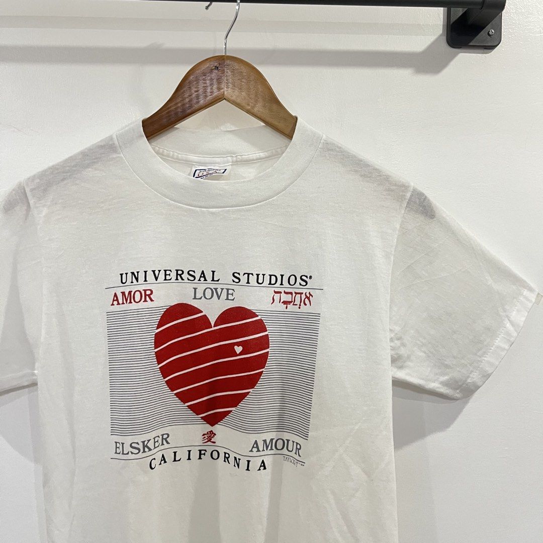 Vintage 80's Universal Studios Love Shirt (Category: Tshirts & Polo Shirts ) located in Calamba. Submitted by barraxarchive (Listing ID 1432558477, Image 2). Description: Size on tag: Medium (shrunk) Width: 17' Length: 27' Single stitch all over No issues Excellent Condition 🏷️ ₱380 📍 Calamba, Laguna.