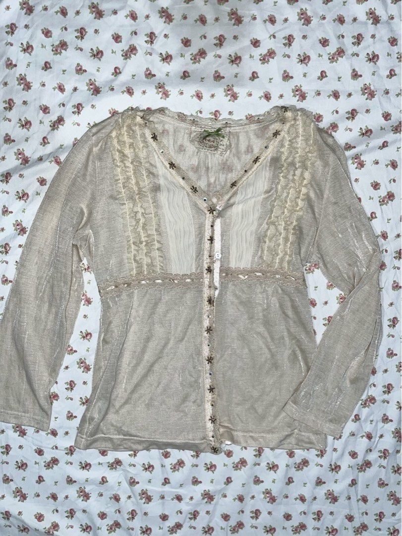 Vintage Beige Blouse with Lace Details (Category: Blouses) located in Pasay City. Submitted by prettiest_girl_in_the_world (Listing ID 1432437459, Image 1). Description: - Vintage beige blouse - Intricate lace and ruffle detailing - V-neckline - Long sleeves - Decorative embellishments - Semi-sheer fabric - Perfect for vintage-inspired looks.