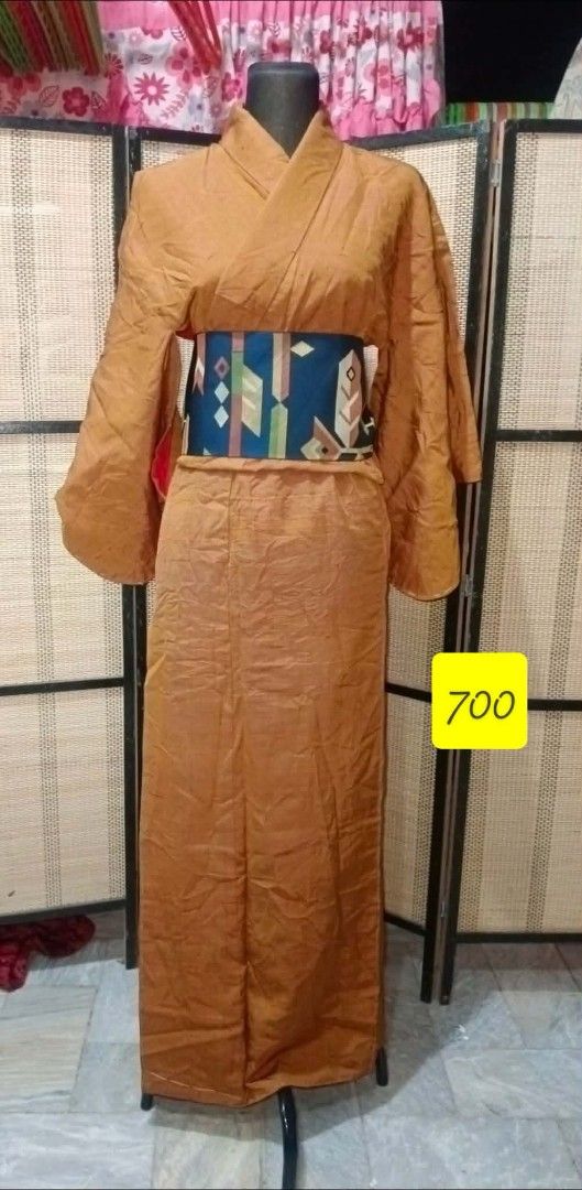 Vintage Kimono with Obi (Category: Coats, Jackets and Outerwear) located in Paranaque City. Submitted by kimono_sisters27 (Listing ID 1432515594, Image 1). Description: - Vintage brown kimono - Includes matching obi belt - Obi belt features geometric pattern (blue, green, white) - Long sleeves - Classic wrap-around design - Great for special occasions.