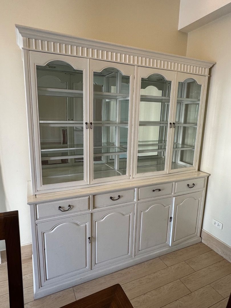 White Dining Display Cabinet with Glass Doors (Category: Shelves, Cabinets & Racks) located in Manila. Submitted by mads55667 (Listing ID 1432511157, Image 2). Description: Dining Room Cabinet/Buffet Fair condition - With a few missing/loose handles, drawers which are not as easy to pull out, cabinet doors not fully closing 72x19xH78.5 - Elegant white display cabinet - Features glass-door sections on top - Includes solid-door sections with drawer