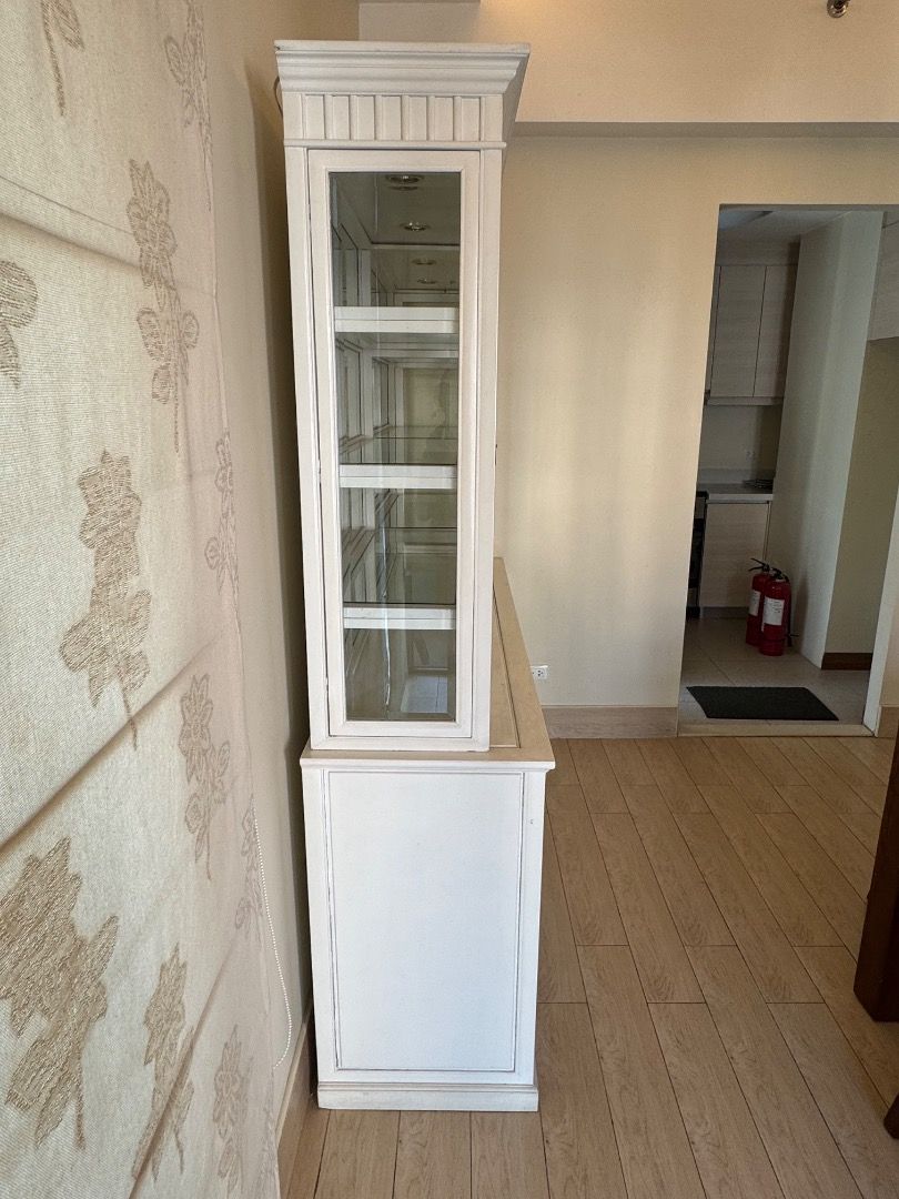 White Dining Display Cabinet with Glass Doors (Category: Shelves, Cabinets & Racks) located in Manila. Submitted by mads55667 (Listing ID 1432511157, Image 3). Description: Dining Room Cabinet/Buffet Fair condition - With a few missing/loose handles, drawers which are not as easy to pull out, cabinet doors not fully closing 72x19xH78.5 - Elegant white display cabinet - Features glass-door sections on top - Includes solid-door sections with drawer