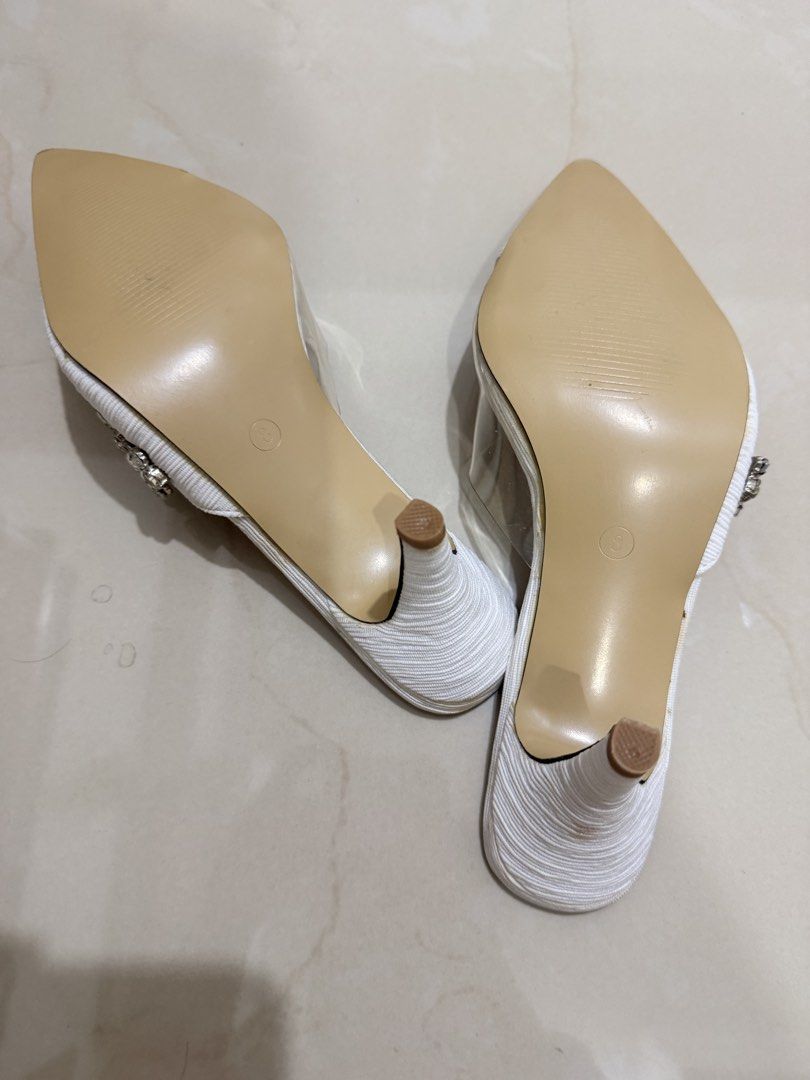 White Heels with Rhinestone Detail (Category: Heels) located in Cebu City. Submitted by dr_marsh (Listing ID 1432443253, Image 2). Description: Never been used Elegant white heels with pointed toe, rhinestone embellishments, and clear strap. Unworn condition..