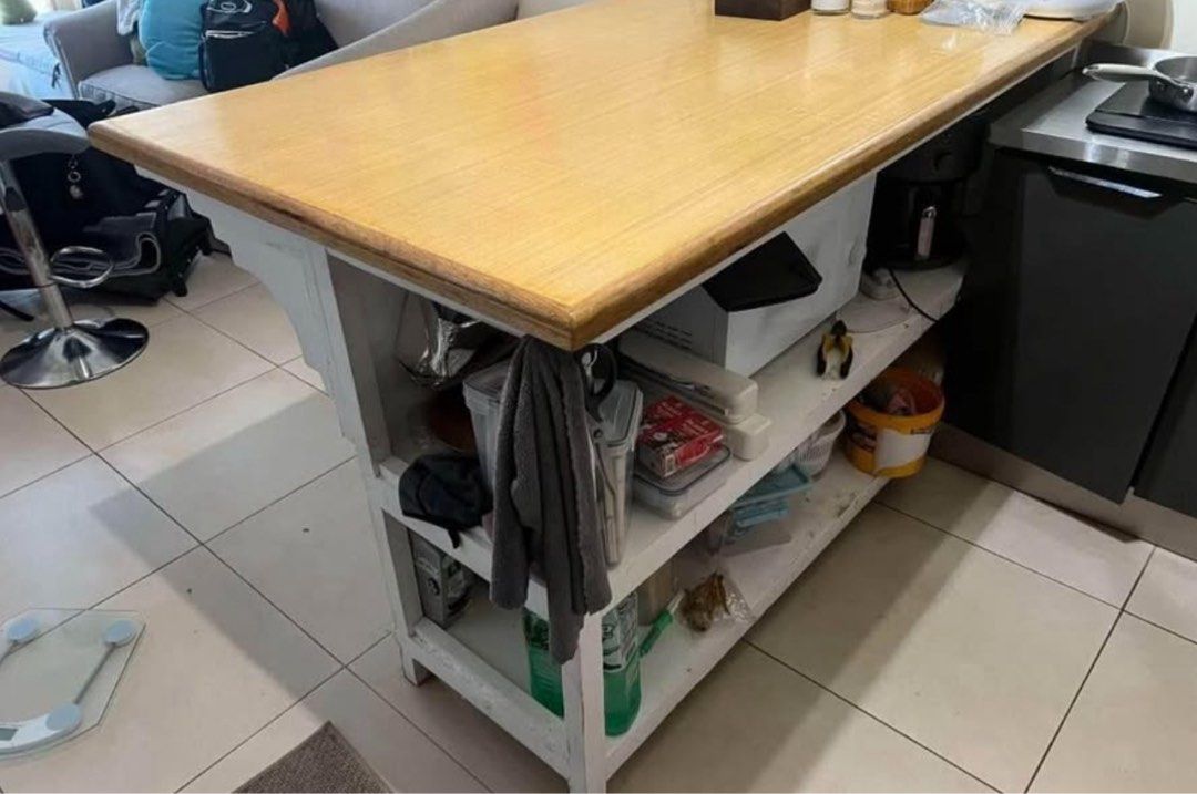 Wooden Kitchen Island with Storage (Category: Shelves, Cabinets & Racks) located in Quezon City. Submitted by blepblop (Listing ID 1432466453, Image 2). Description: - Wooden kitchen island - Light-colored countertop - White storage base - Open shelving and enclosed storage - Ideal for extra workspace and storage - Perfect for small spaces.