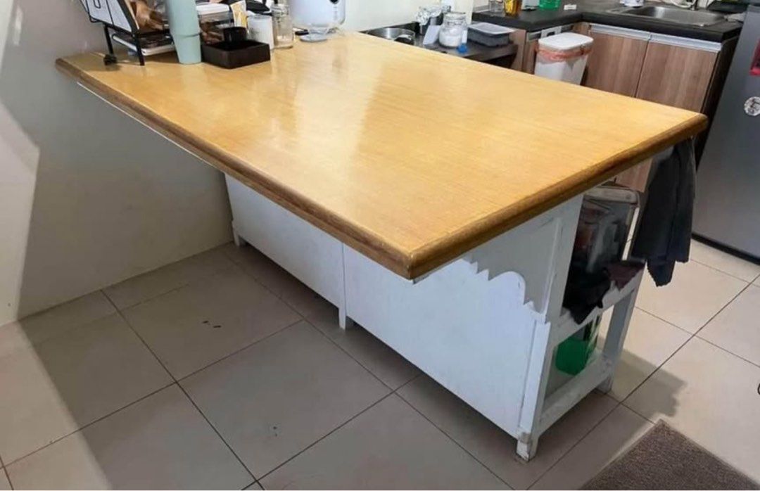 Wooden Kitchen Island with Storage (Category: Shelves, Cabinets & Racks) located in Quezon City. Submitted by blepblop (Listing ID 1432466453, Image 1). Description: - Wooden kitchen island - Light-colored countertop - White storage base - Open shelving and enclosed storage - Ideal for extra workspace and storage - Perfect for small spaces.